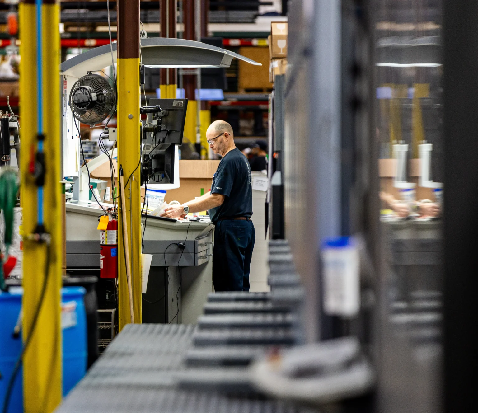 A man stands at a flexographic label printing line