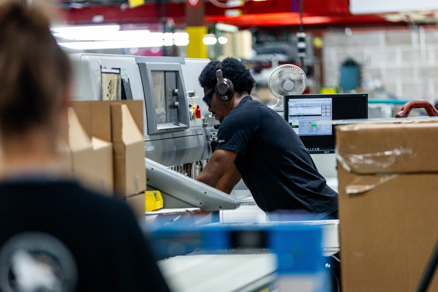 Product label efficiency is helped by label manufacturers, such as this man on the cutting and QC line